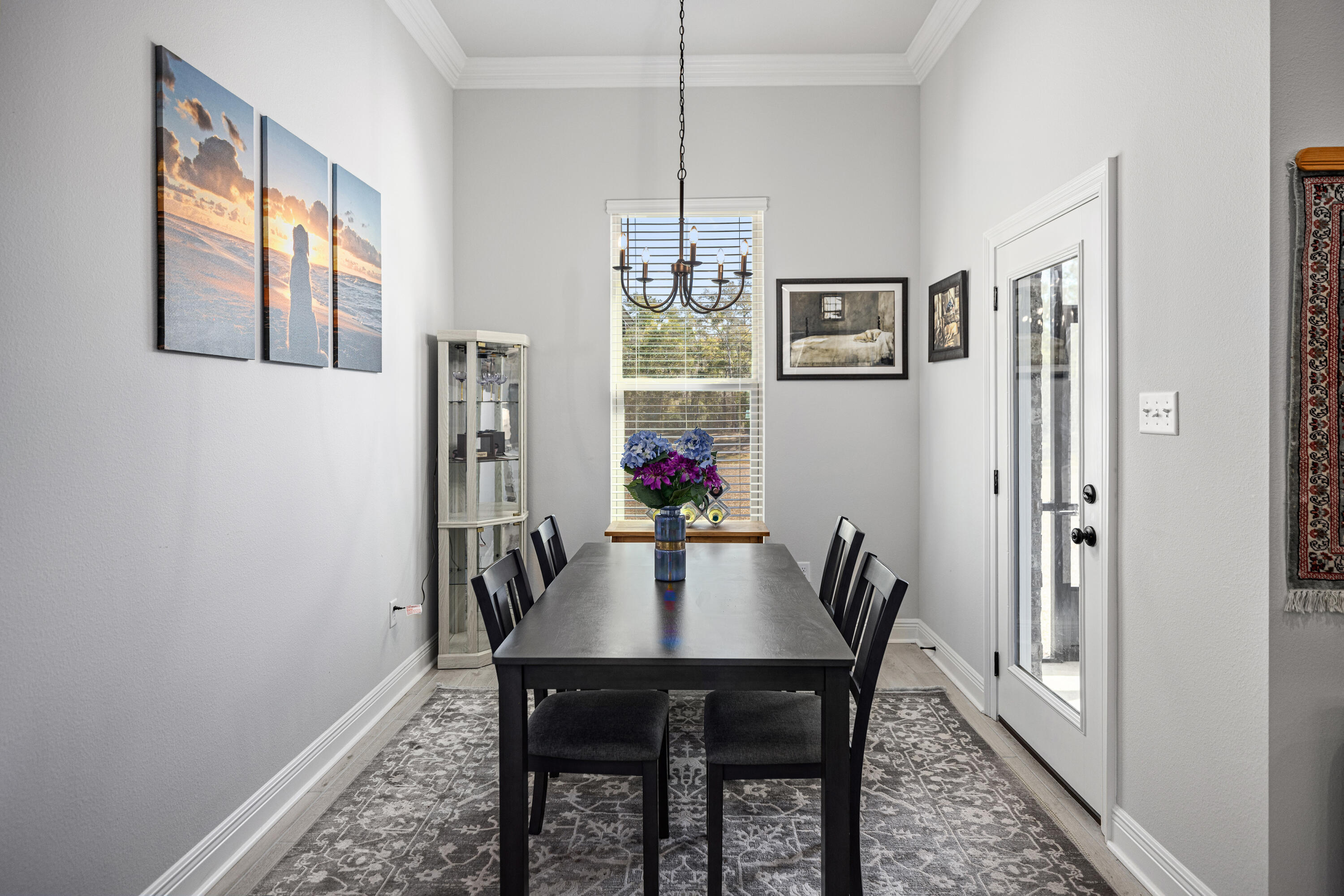 132 East Tweet Street Freeport, FL 32439 - Photo 18 of 79 a view of a dining room with furniture window and wooden floor