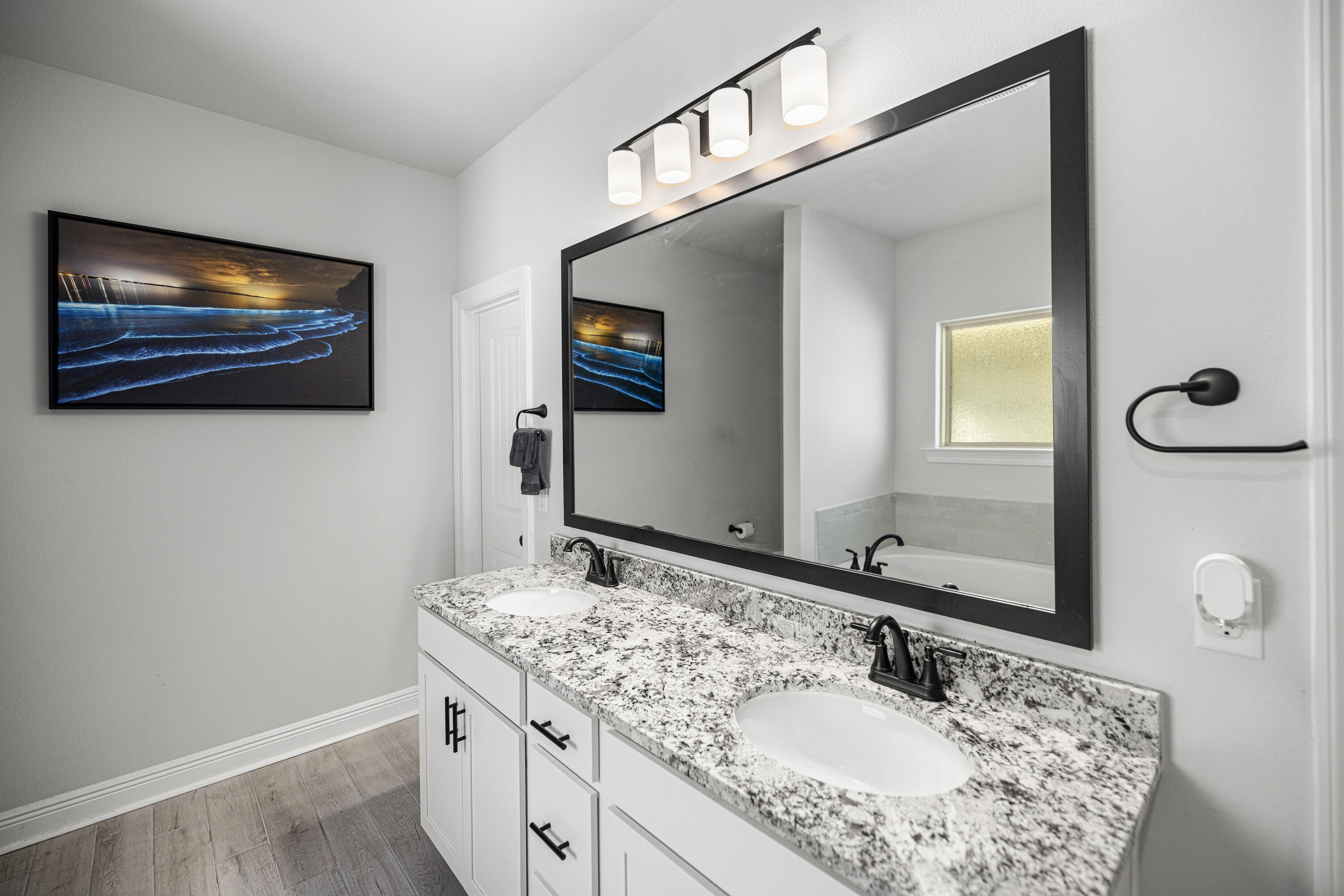 132 East Tweet Street Freeport, FL 32439 - Photo 23 of 79 a bathroom with a sink a mirror and a vanity