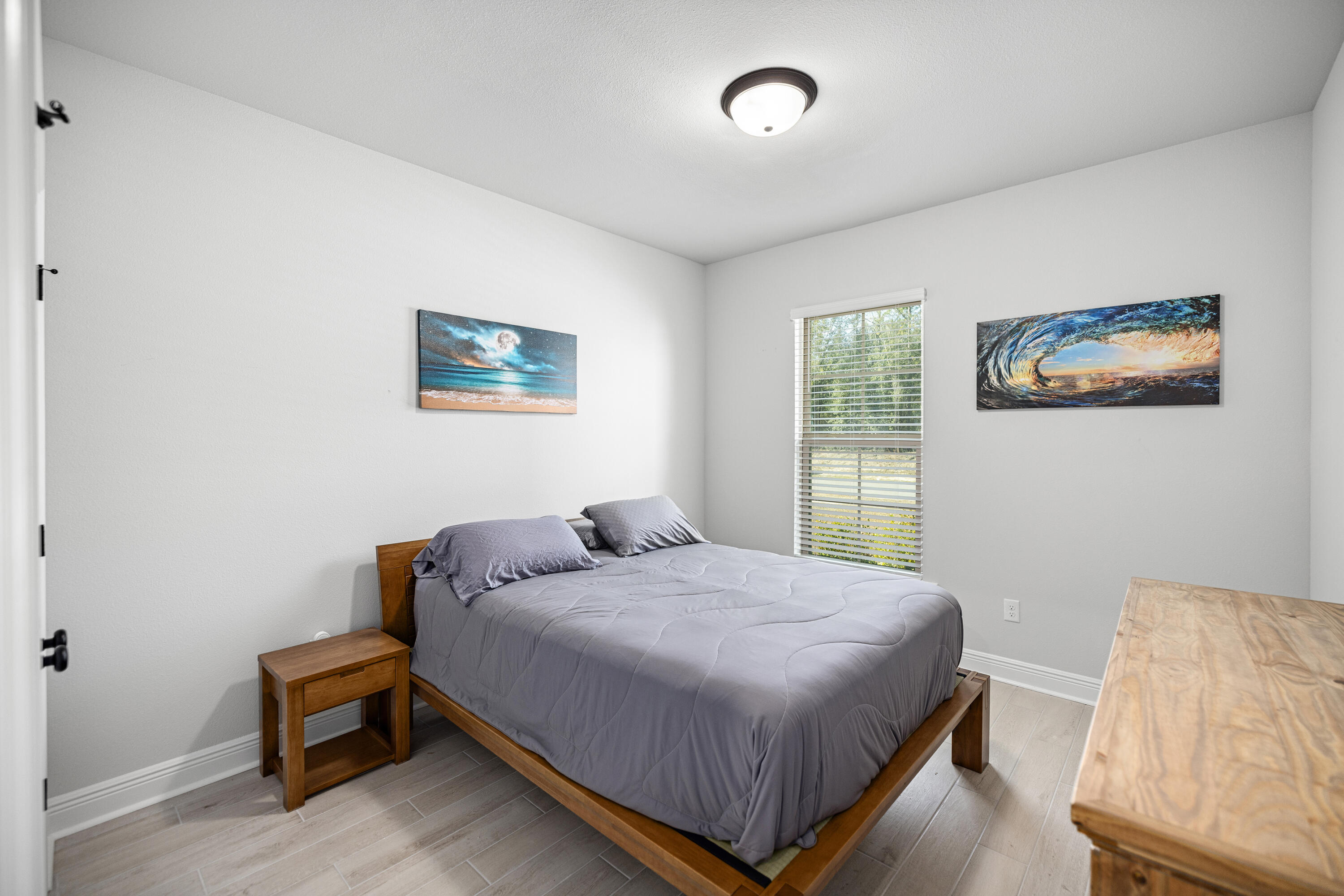 132 East Tweet Street Freeport, FL 32439 - Photo 26 of 79 a bedroom with a bed and a window