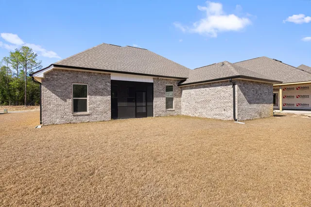 a view of a house with outdoor space and sitting area