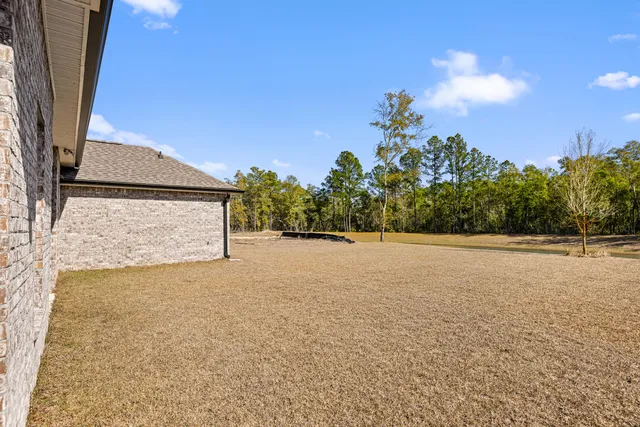 a building outdoor space with patio furniture and a potted plant