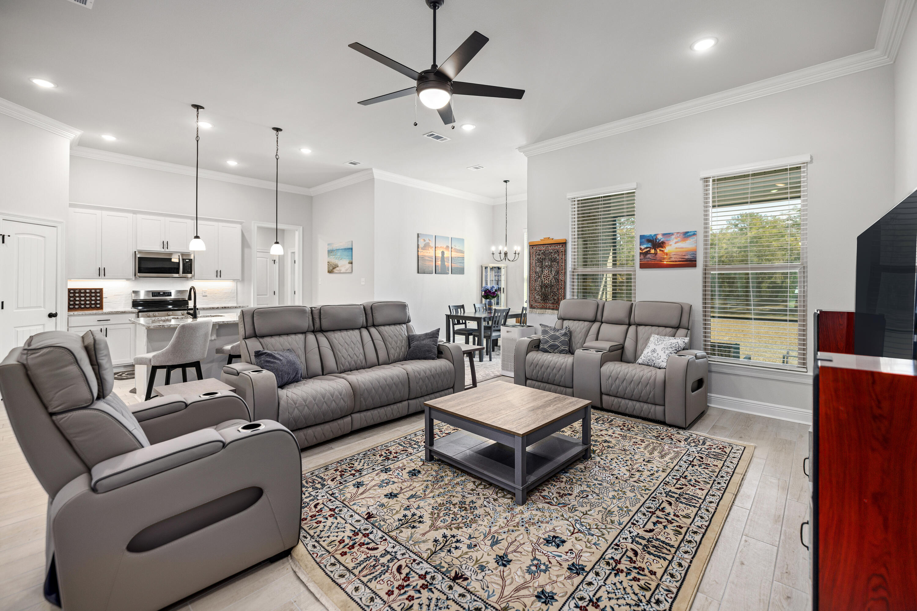 132 East Tweet Street Freeport, FL 32439 - Photo 9 of 79 a living room with furniture ceiling fan and a rug