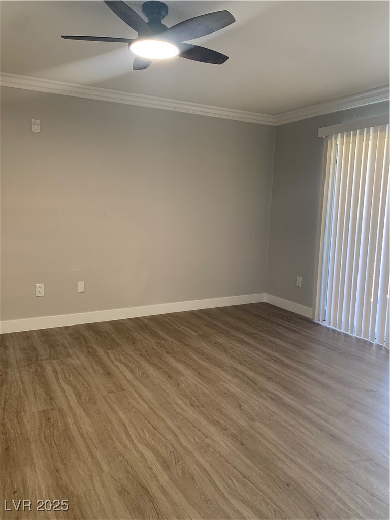 8101 West Flamingo Road, Unit 1102 Las Vegas, NV 89147 - Photo 6 of 54 Empty room with crown molding, ceiling fan, and wood finished floors