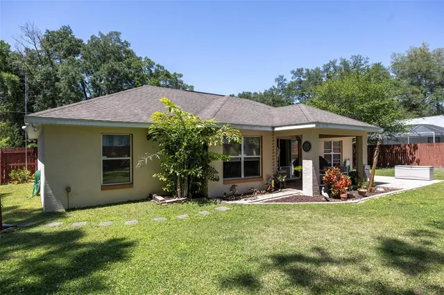 a front view of a house with a garden and porch