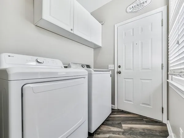a view of storage and utility room with washer and dryer