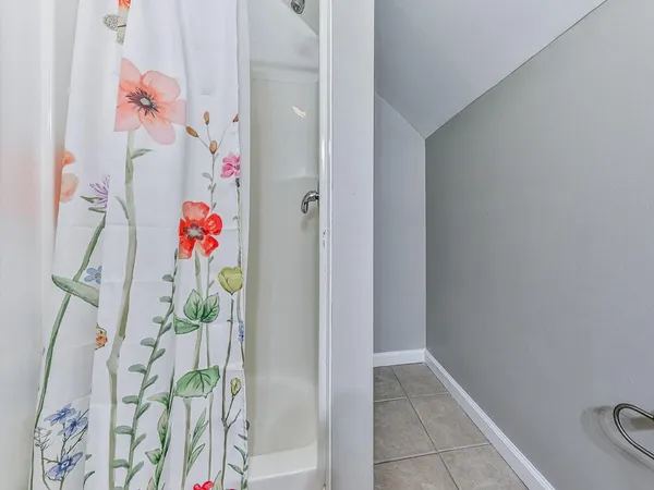 a bathroom with a sink and a shower curtain