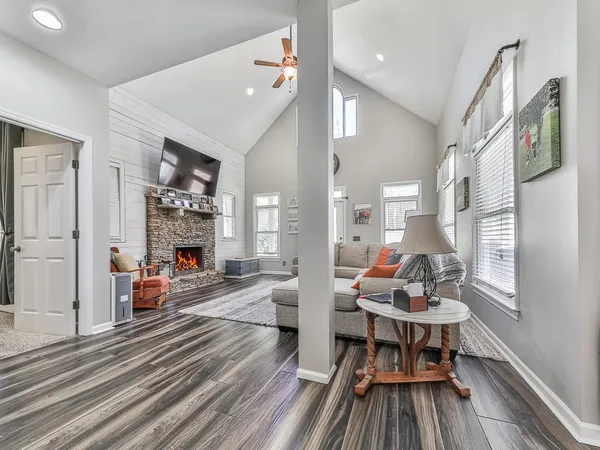 a living room with furniture and a fireplace