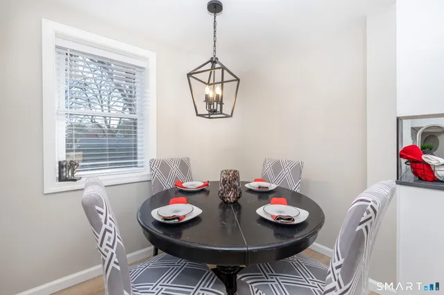 an empty room with windows and ceiling fan