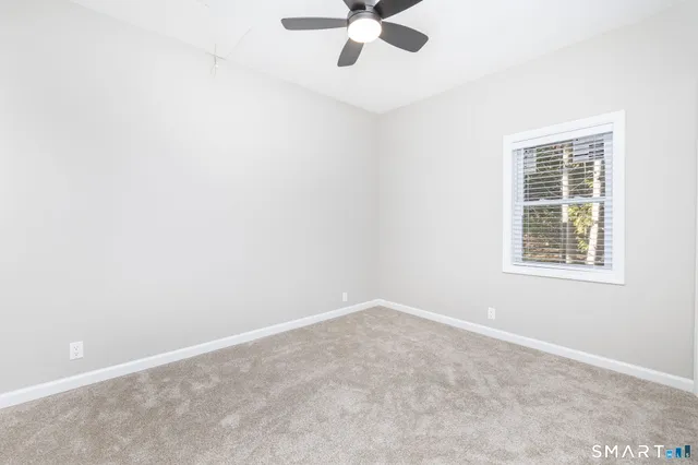 a view of a room with wooden walls