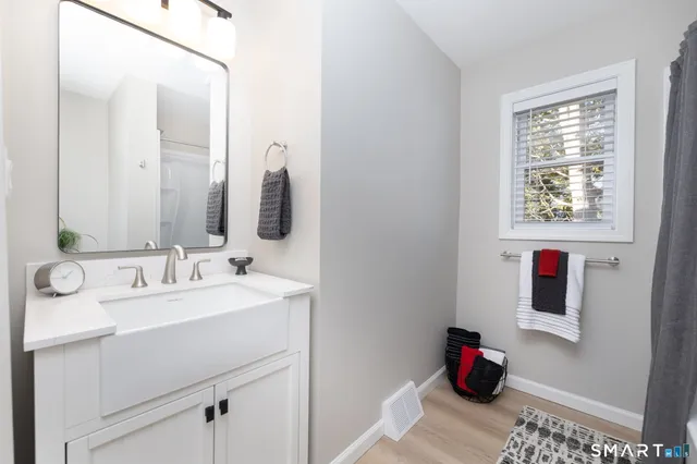 a backyard of a house with table and chairs