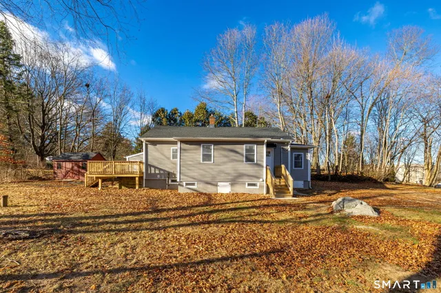 a view of a house with a snow in the yard