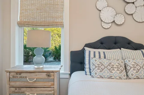 a bathroom with a toilet a sink and a mirror