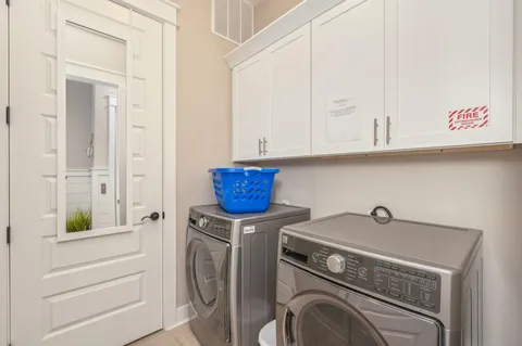 a view of a house with backyard porch and sitting area