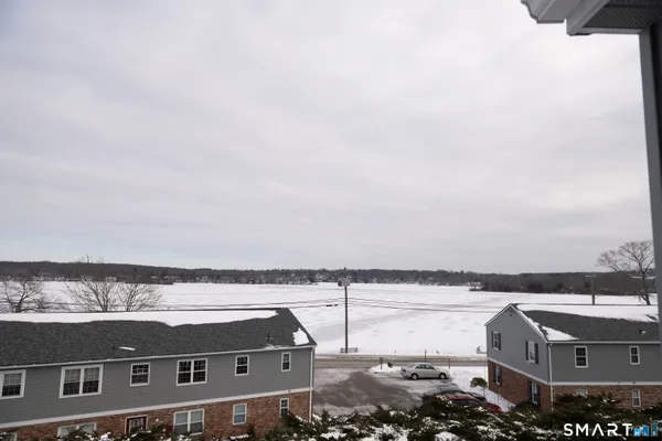 an aerial view of residential building and ocean view