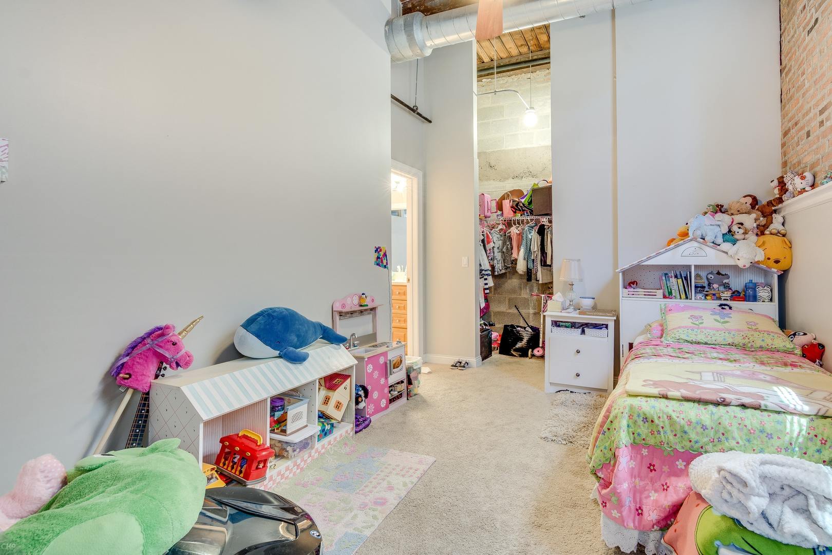 1500 West Monroe Street, Unit 122 Chicago, IL 60607 - Photo 11 of 14 a bedroom with furniture and a bed