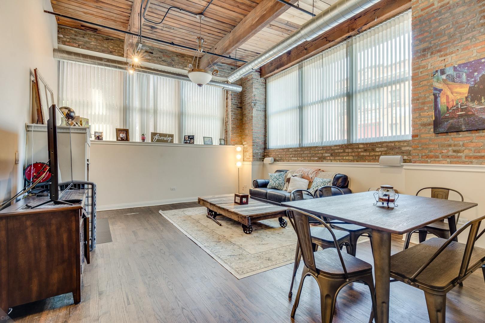 1500 West Monroe Street, Unit 122 Chicago, IL 60607 - Photo 7 of 14 a view of a dining room with furniture window and wooden floor