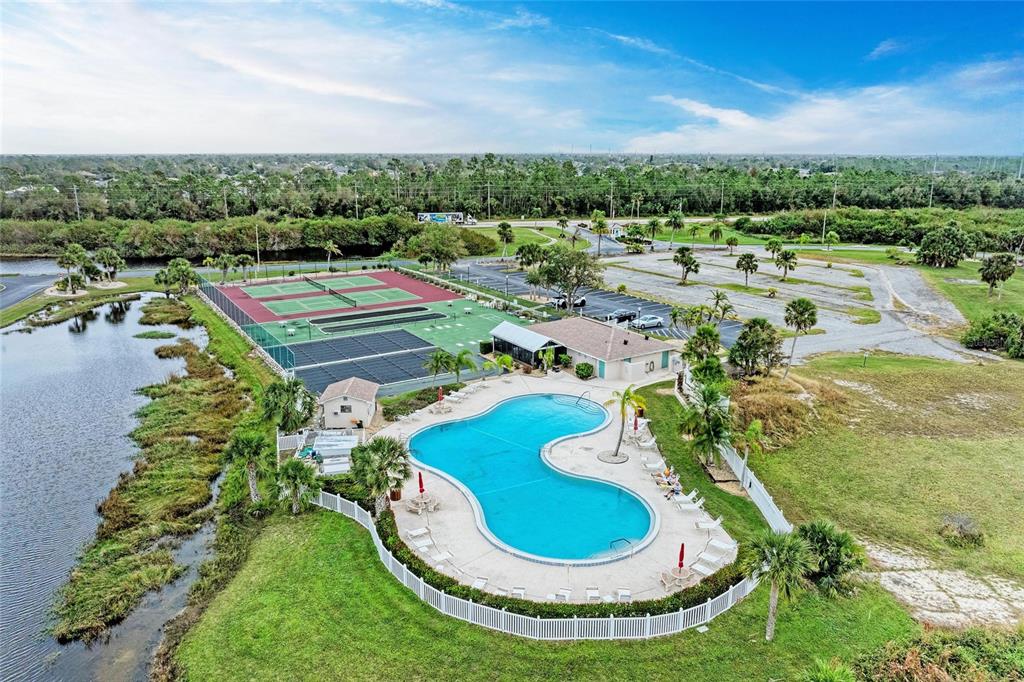 175 Kings Highway, Unit 1114 Punta Gorda, FL 33983 - Photo 1 of 64 a view of a swimming pool with a yard