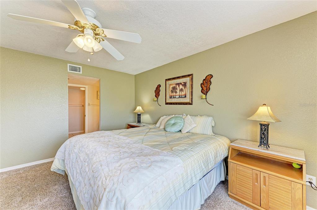 175 Kings Highway, Unit 1114 Punta Gorda, FL 33983 - Photo 24 of 64 a bedroom with a bed and a lamp