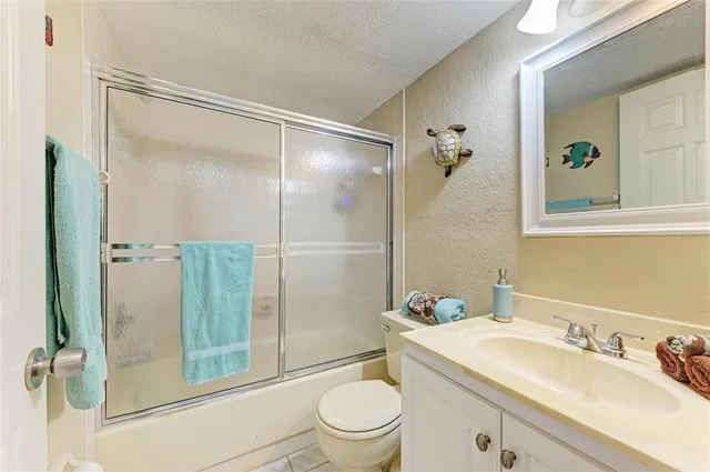 a view of a house with backyard porch and sitting area