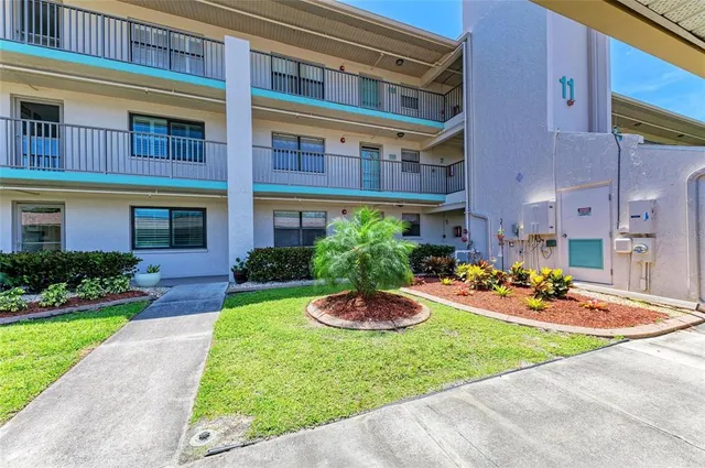a view of a garden with sitting area