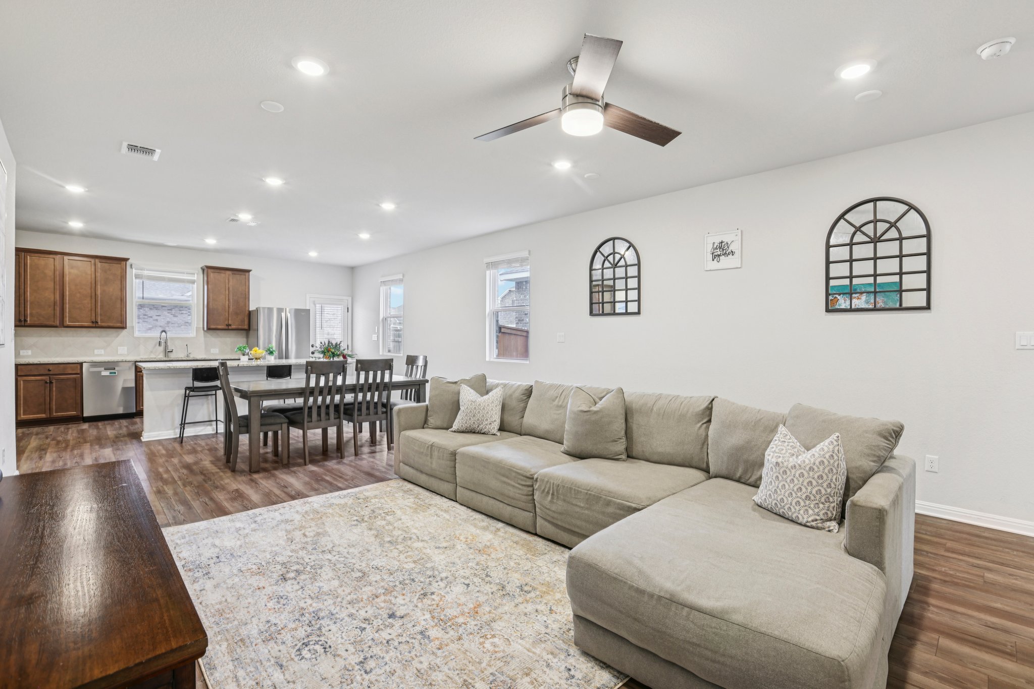 204 Swinging H Lane Georgetown, TX 78633 - Photo 1 of 39 Open concept living space featuring recessed lighting, a ceiling fan, and wood-look flooring