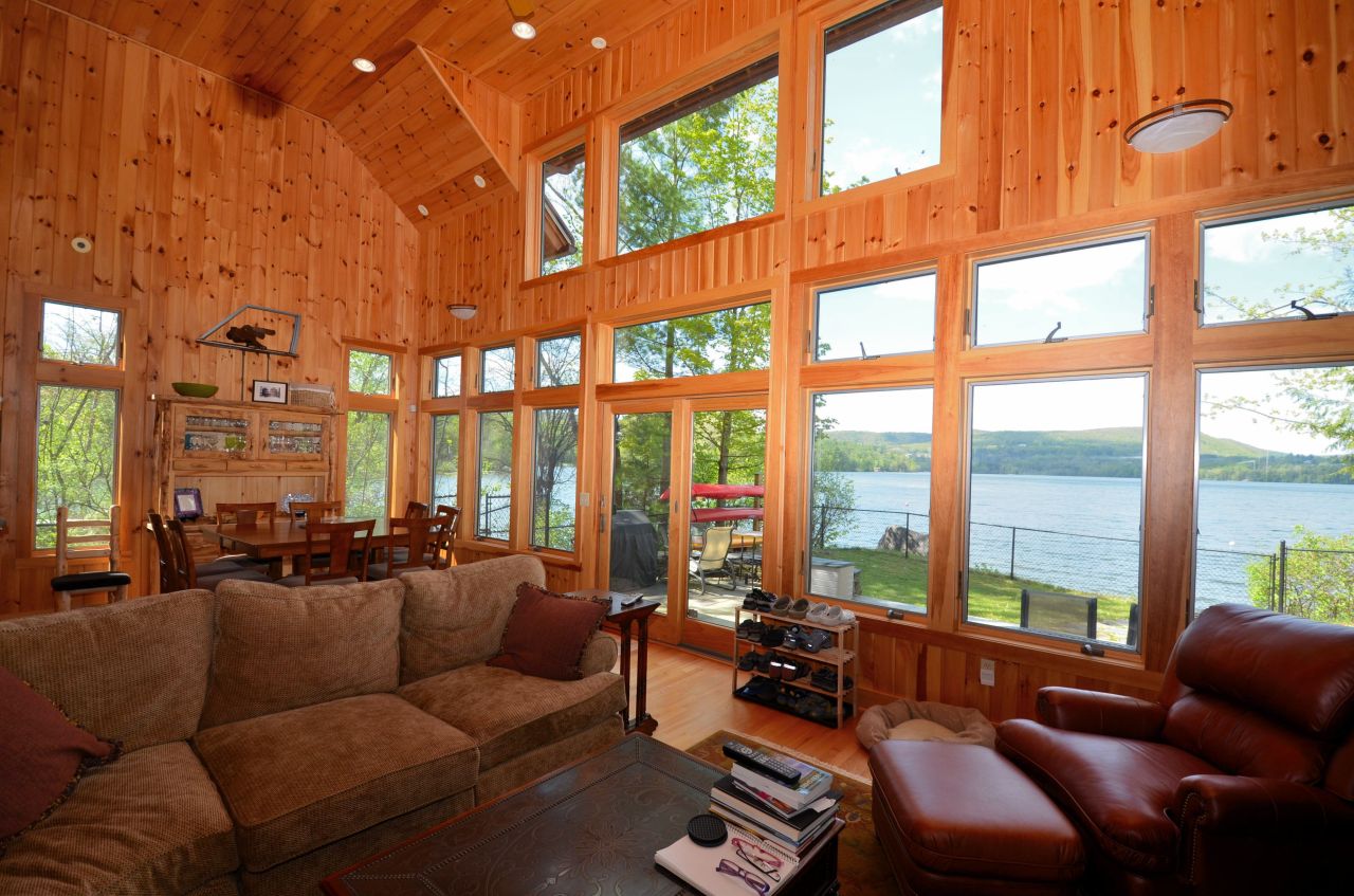 16 Grove Road Stockbridge, MA 01262 - Photo 8 of 13 a living room with furniture city floor to ceiling windows and a flat screen tv