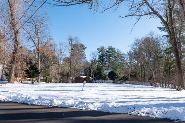 a view of a house with a snow on the road