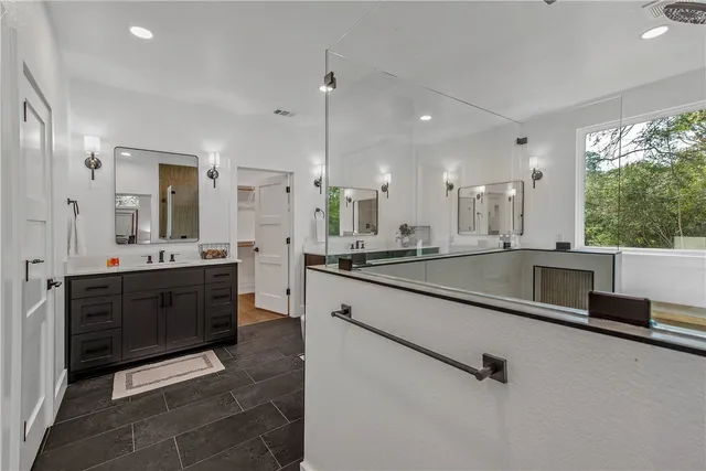 a view of a yard with plants and trees