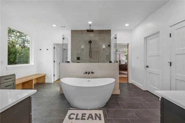 a view of a yard with plants and trees