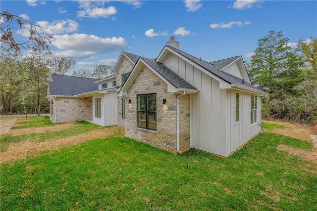 a view of a yard with trees