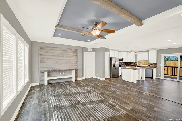 a view of kitchen with sink microwave and stove
