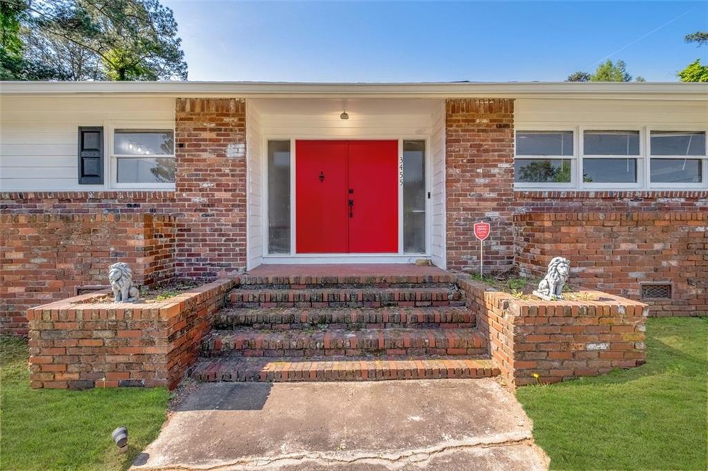 3455 Spring Valley Road Decatur, GA 30032 - Photo 1 of 1 a front view of a house with garden
