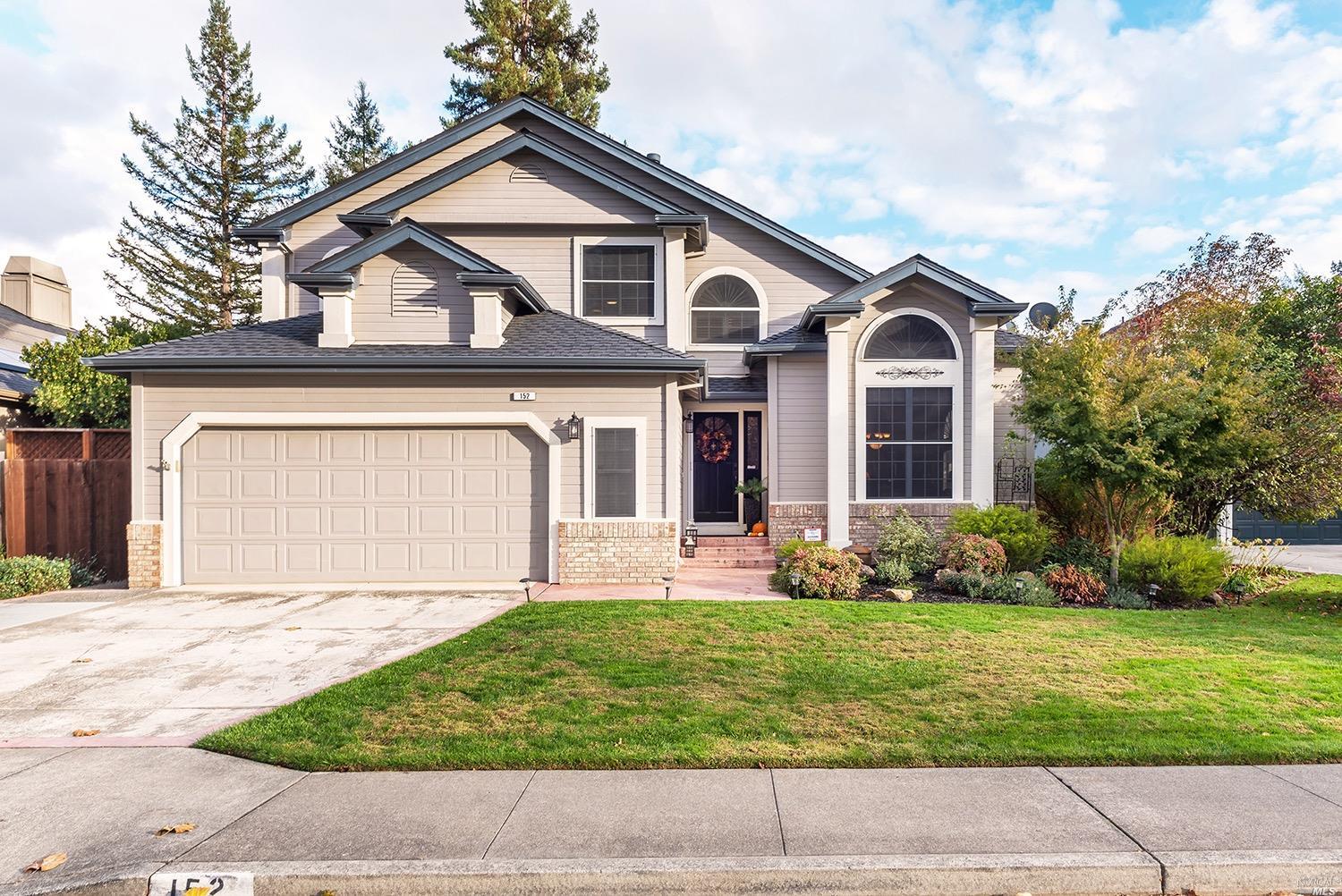 152 Hop Ranch Road Santa Rosa, CA 95403 - Photo 1 of 1 a front view of a house with a yard and garage