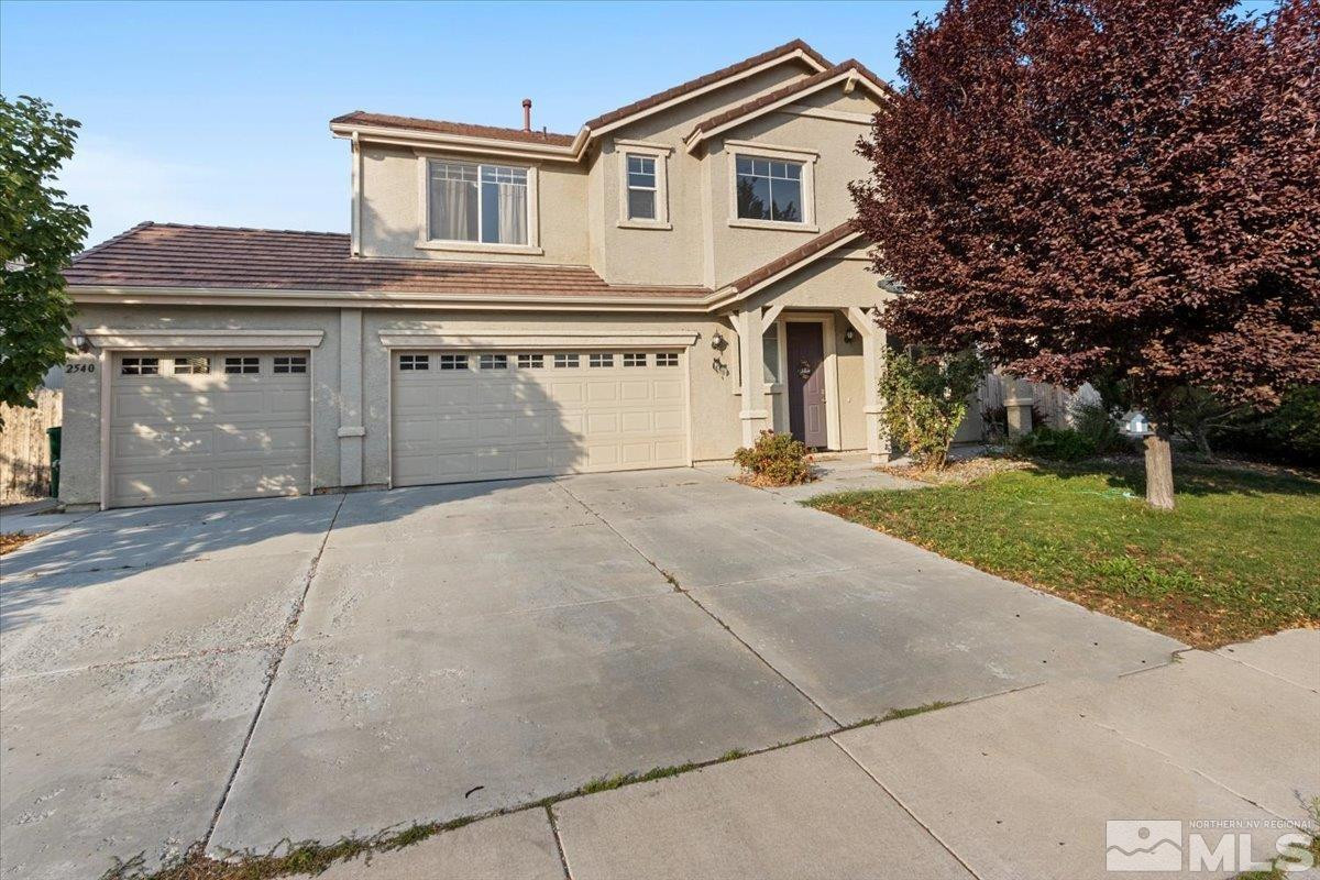 2540 Perryville Drive Reno, NV 89521 - Photo 1 of 27 a front view of a house with a yard