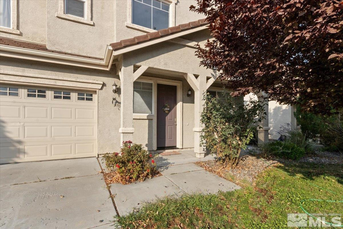 2540 Perryville Drive Reno, NV 89521 - Photo 2 of 27 a front view of a house with garden