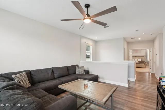 an aerial view of a house with a yard table and chairs