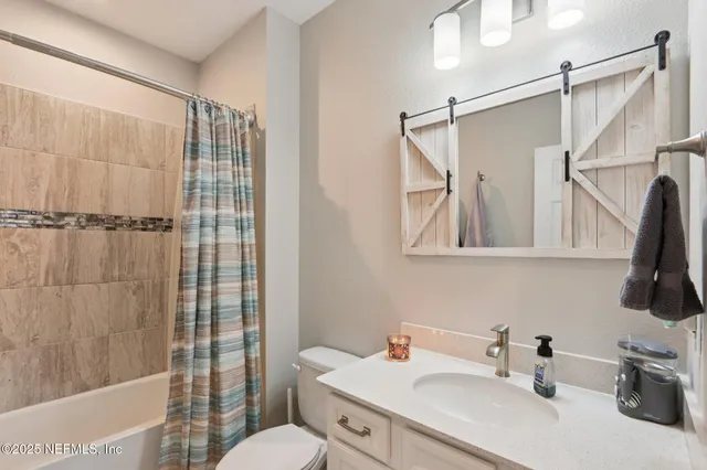 an aerial view of a house with a yard table and chairs