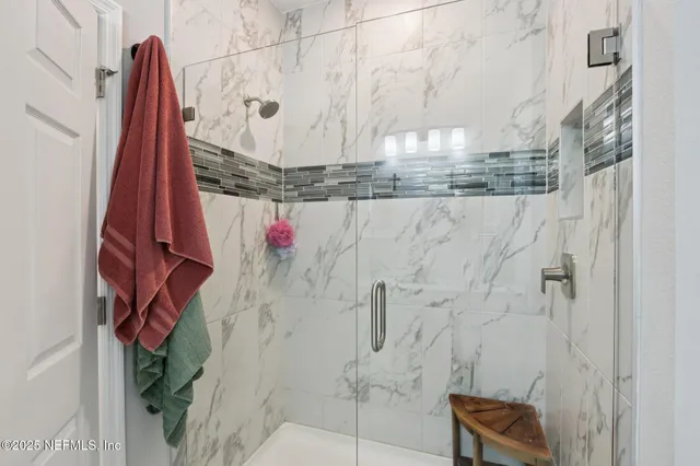 a view of a lake with a yard and a large window