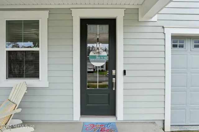 a view of a dining room with furniture wooden floor and chandelier
