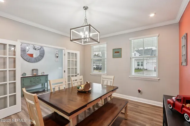 a kitchen with stainless steel appliances a kitchen island sink stove and refrigerator