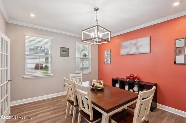 a kitchen with kitchen island a sink and refrigerator