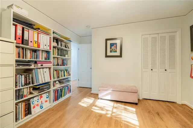 a living room with a book shelf
