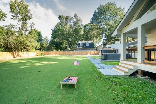 a view of a house with a backyard