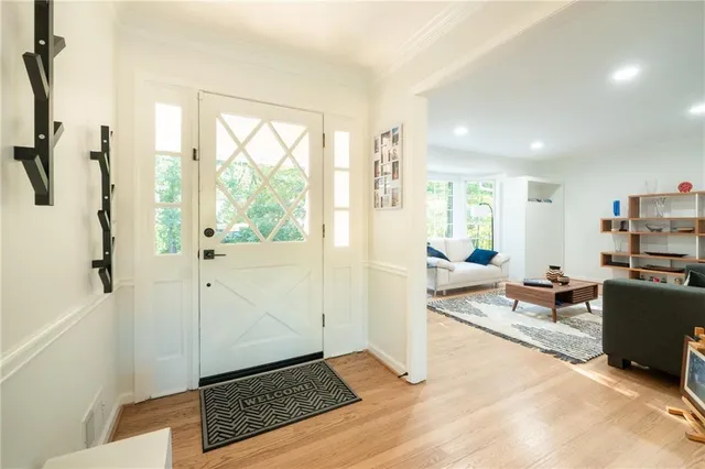 a living room with furniture and a rug