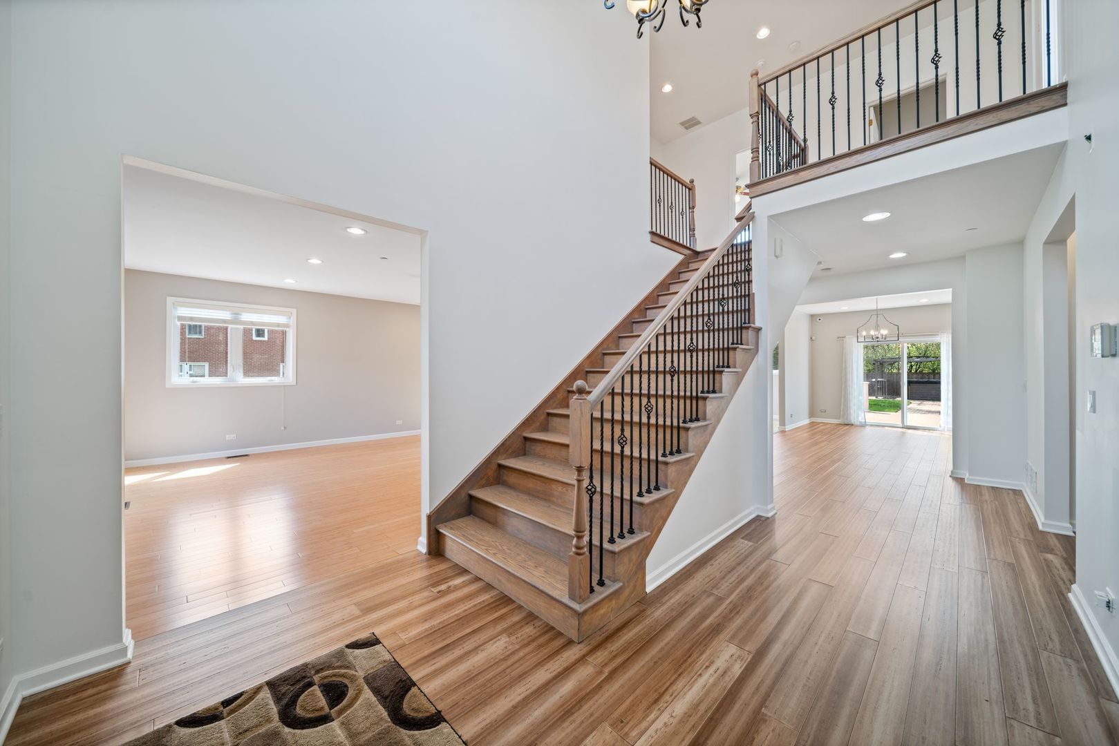 701 Oakton Street Park Ridge, IL 60068 - Photo 2 of 59 a view of entryway with wooden floor and stairs