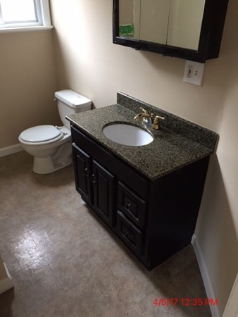 103 Gore Road Webster, MA 01570 - Photo 14 of 24 a bathroom with a granite countertop sink and a toilet