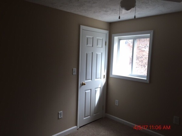 103 Gore Road Webster, MA 01570 - Photo 18 of 24 a view of an empty room with a window
