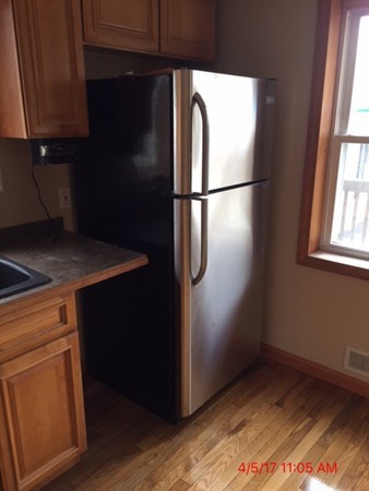 103 Gore Road Webster, MA 01570 - Photo 3 of 24 a kitchen with a refrigerator and cabinets