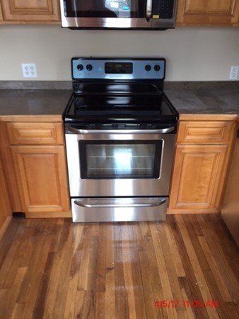 103 Gore Road Webster, MA 01570 - Photo 4 of 24 a stove top oven sitting inside of a kitchen