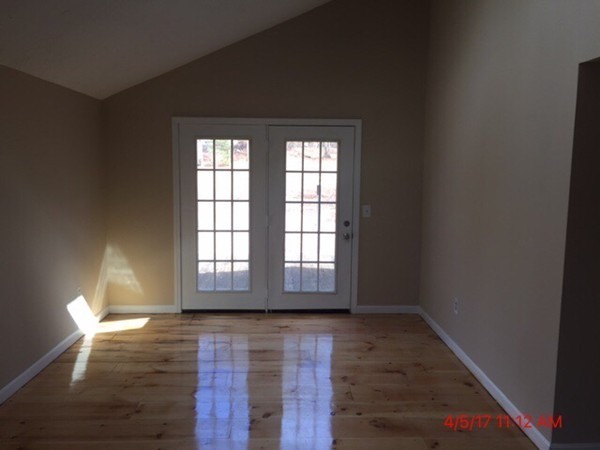 103 Gore Road Webster, MA 01570 - Photo 10 of 24 a view of empty room with wooden floor and fan